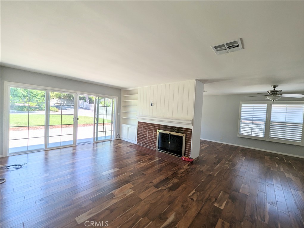 3745 Landfair Road Pasadena, CA 91107 - Photo 4 of 8 wooden floor fireplace and windows in an empty room