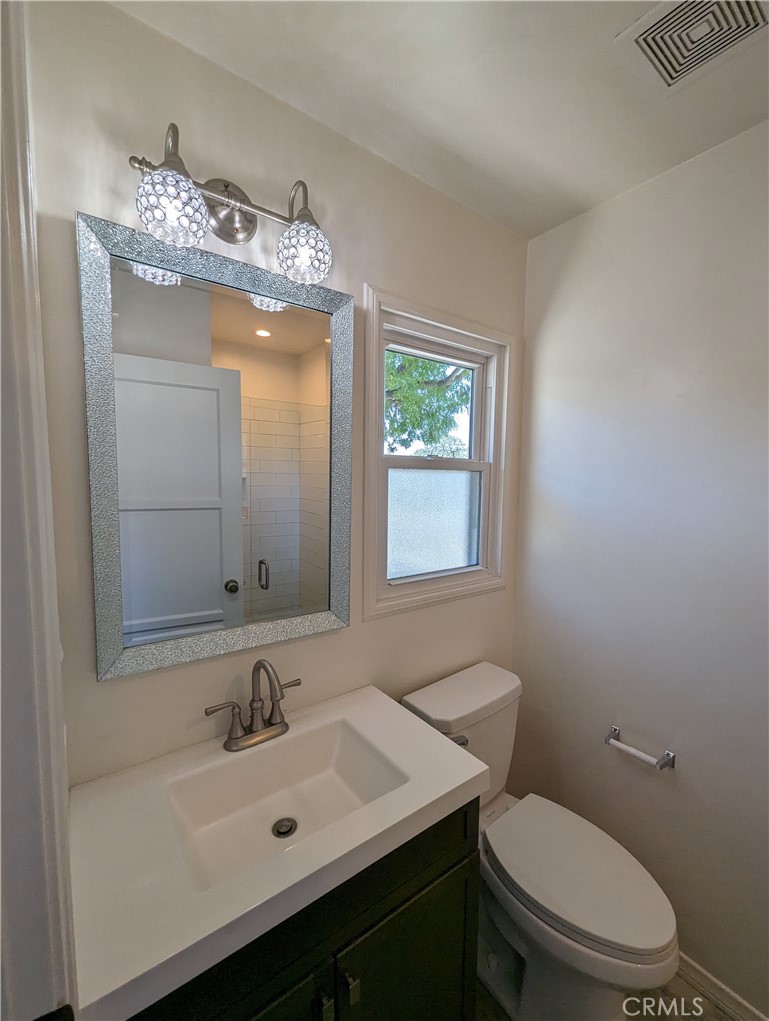 3745 Landfair Road Pasadena, CA 91107 - Photo 5 of 8 a bathroom with a toilet sink and mirror