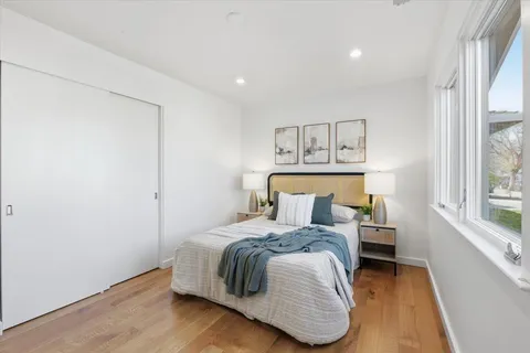 a bedroom with furniture and a window