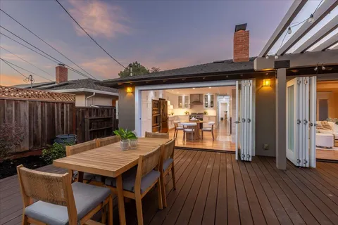 a outdoor living space with patio furniture and wooden floor
