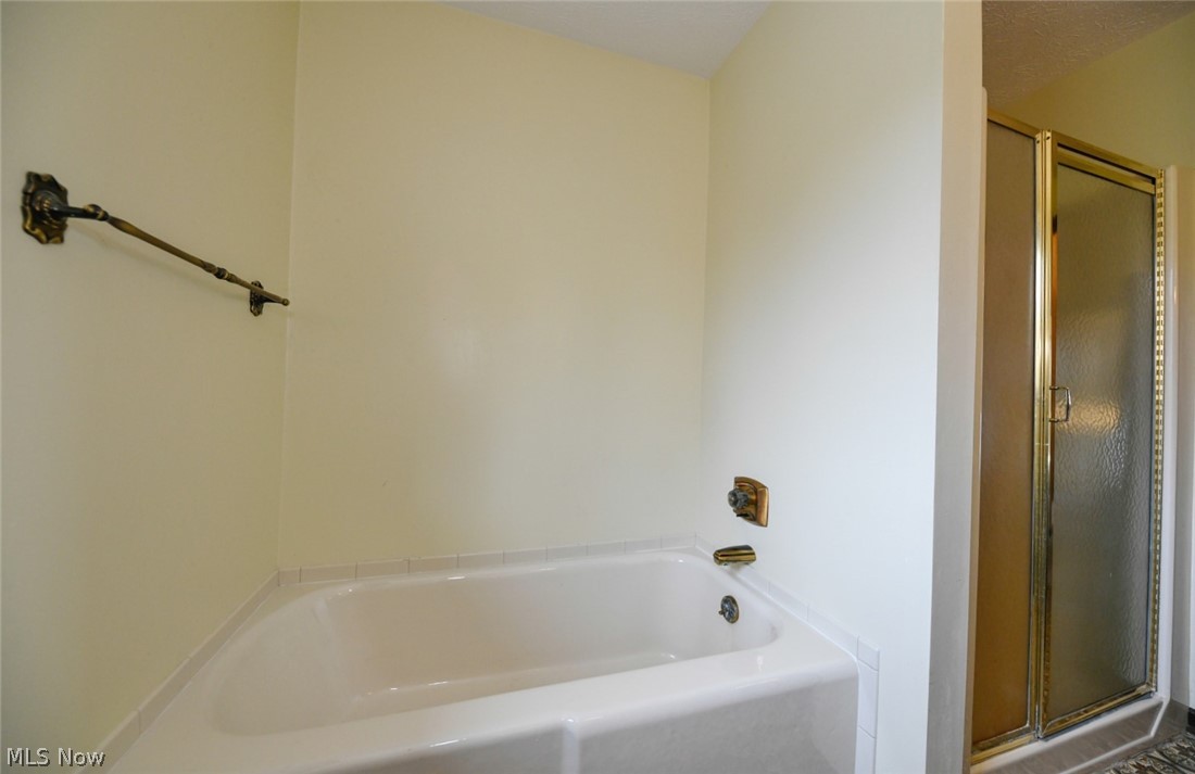915 Sandy Lake Road Kent, OH 44240 - Photo 28 of 35 Hall full bath with tub separate from stand-up shower.