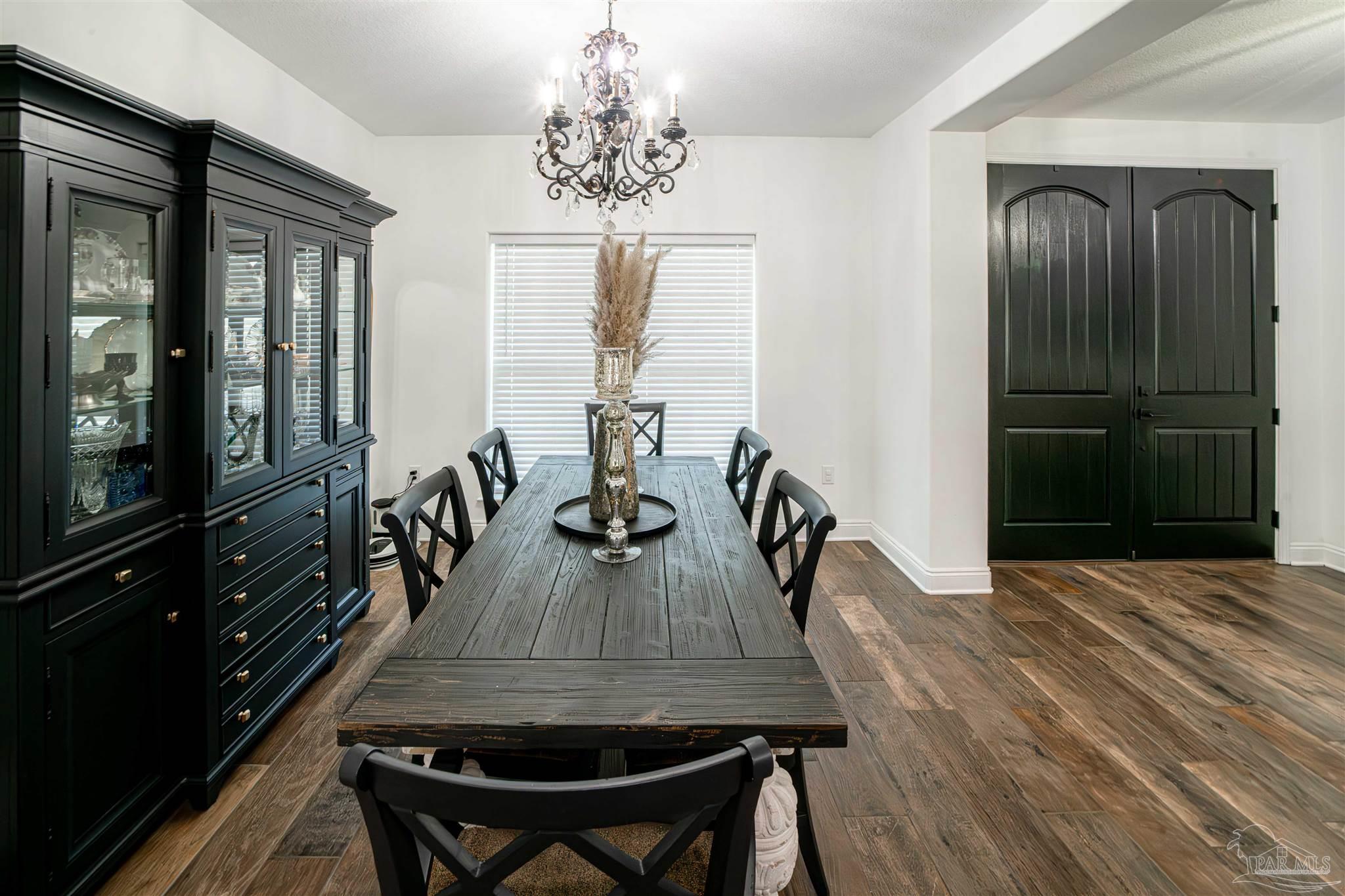8165 Chumuckla Highway Pace, FL 32571 - Photo 11 of 50 a dining room with furniture and window