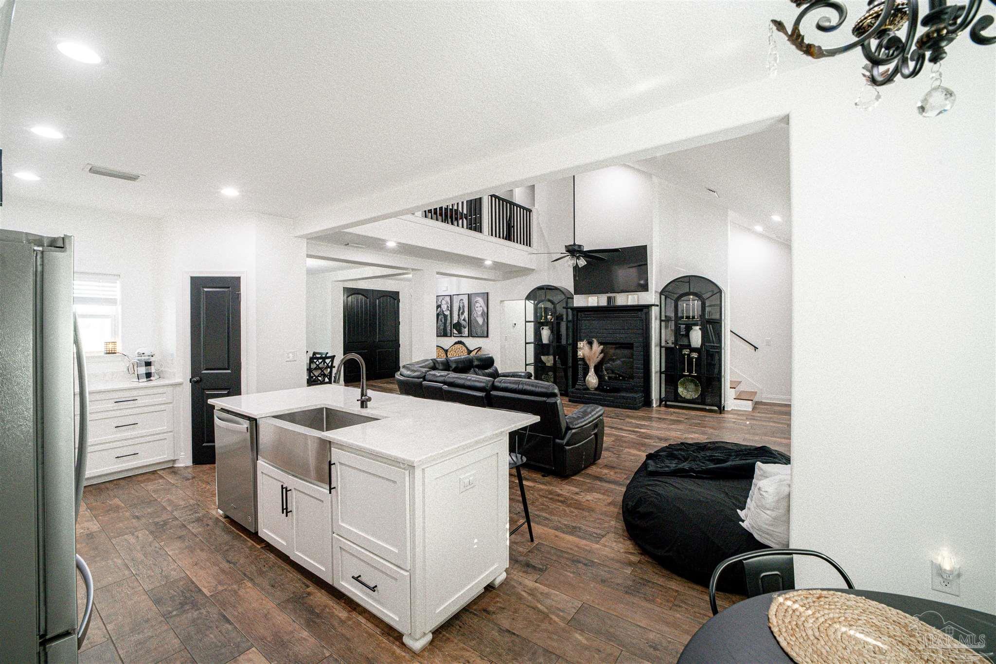 8165 Chumuckla Highway Pace, FL 32571 - Photo 12 of 50 a living room with furniture and a fireplace