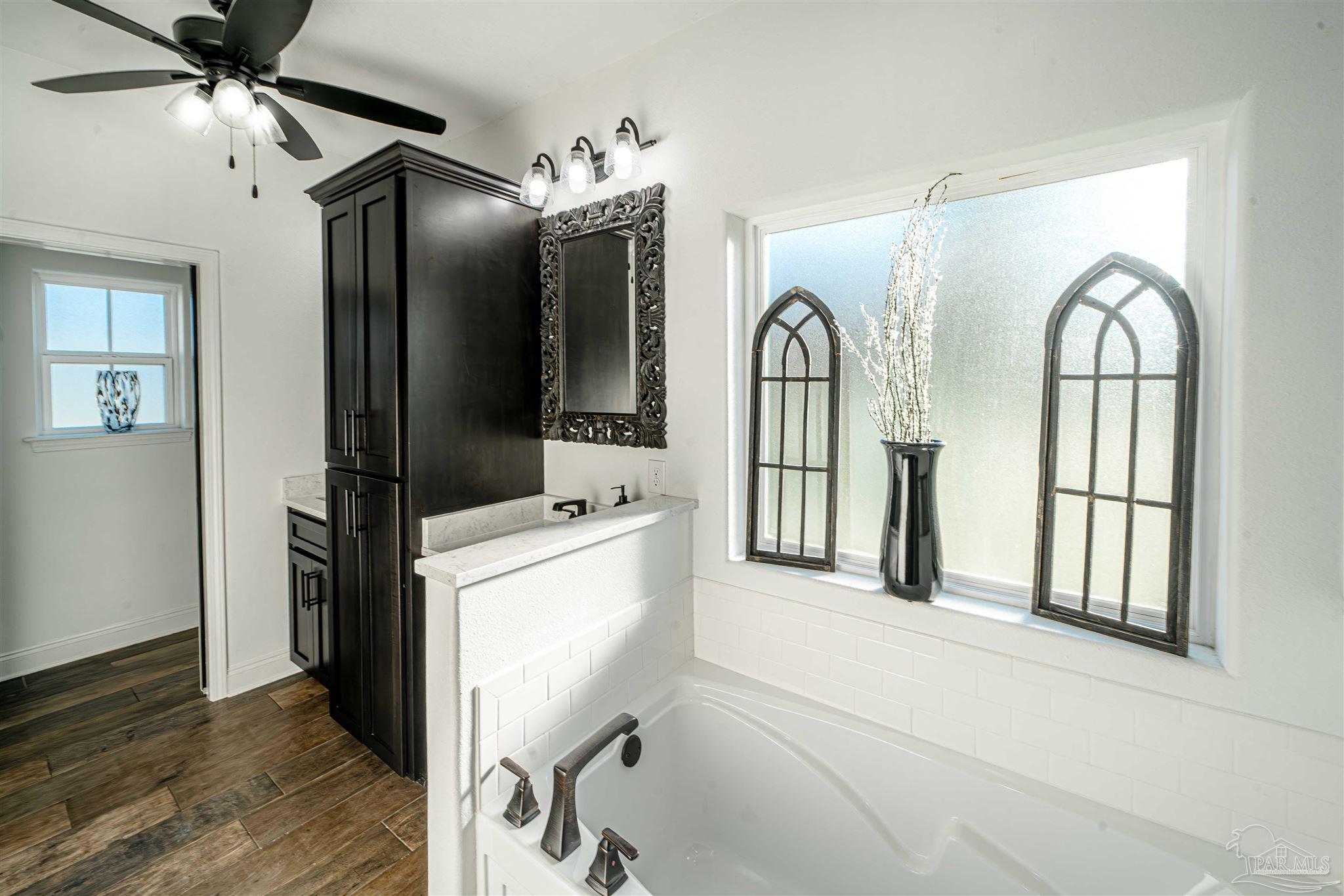 8165 Chumuckla Highway Pace, FL 32571 - Photo 24 of 50 a view of entryway with wooden floor