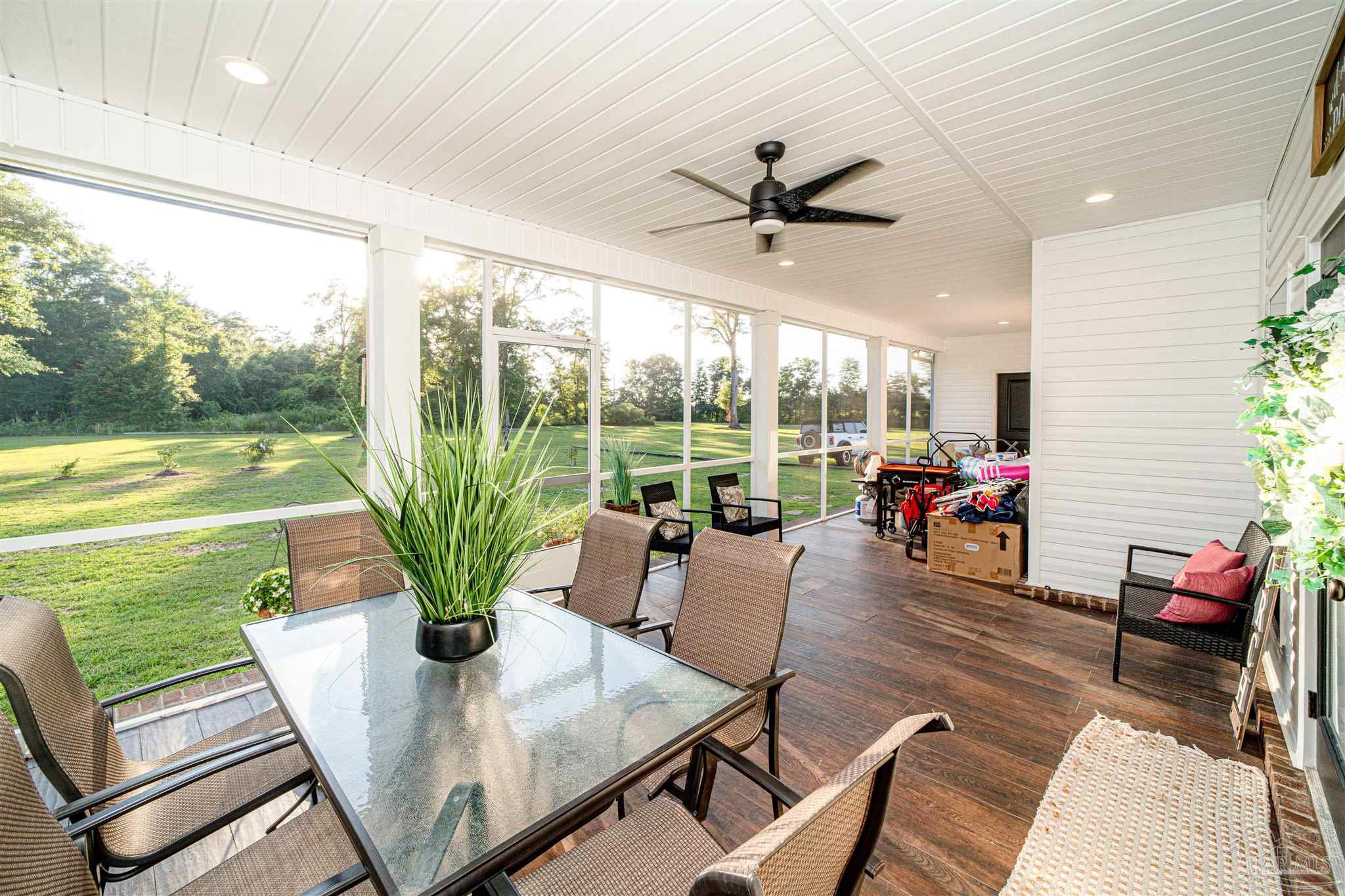 8165 Chumuckla Highway Pace, FL 32571 - Photo 41 of 50 a living room with furniture and garden view