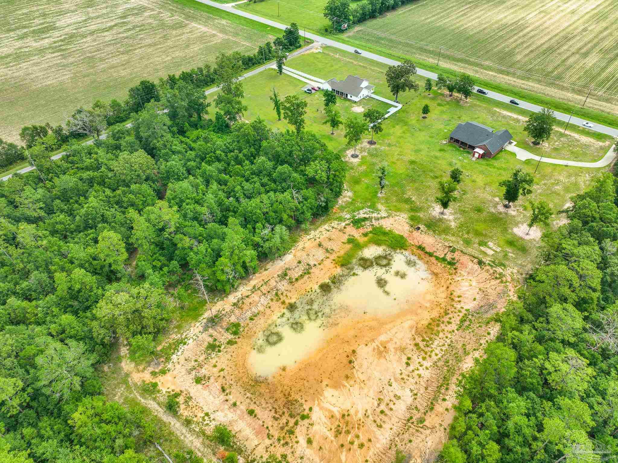 8165 Chumuckla Highway Pace, FL 32571 - Photo 42 of 50 a view of a yard with an umbrella