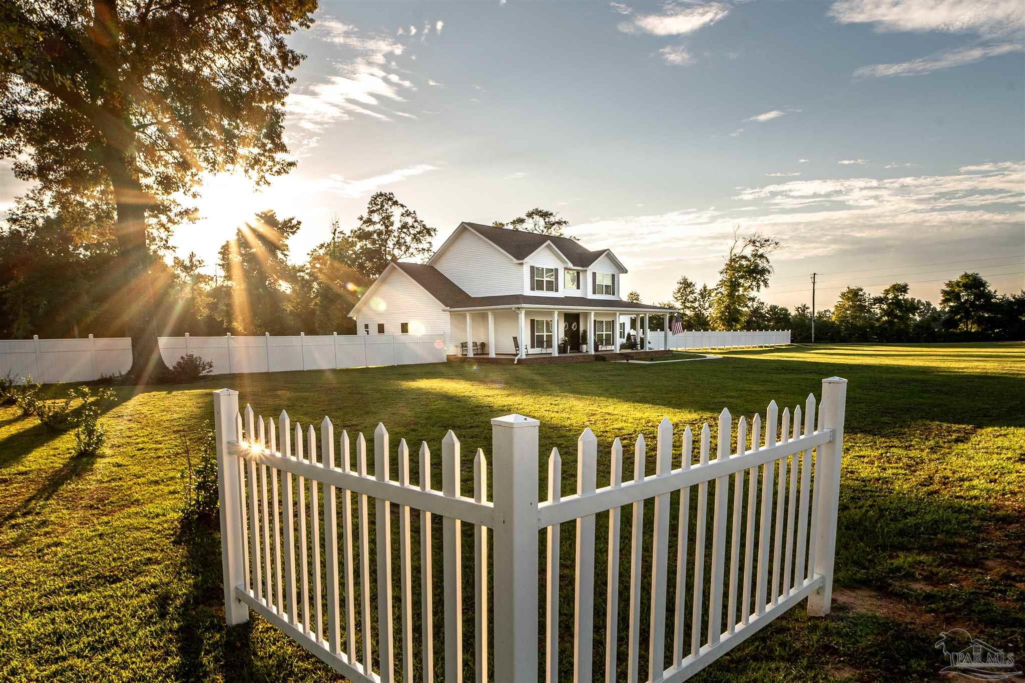 8165 Chumuckla Highway Pace, FL 32571 - Photo 45 of 50 a view of a swimming pool with a lounge chairs