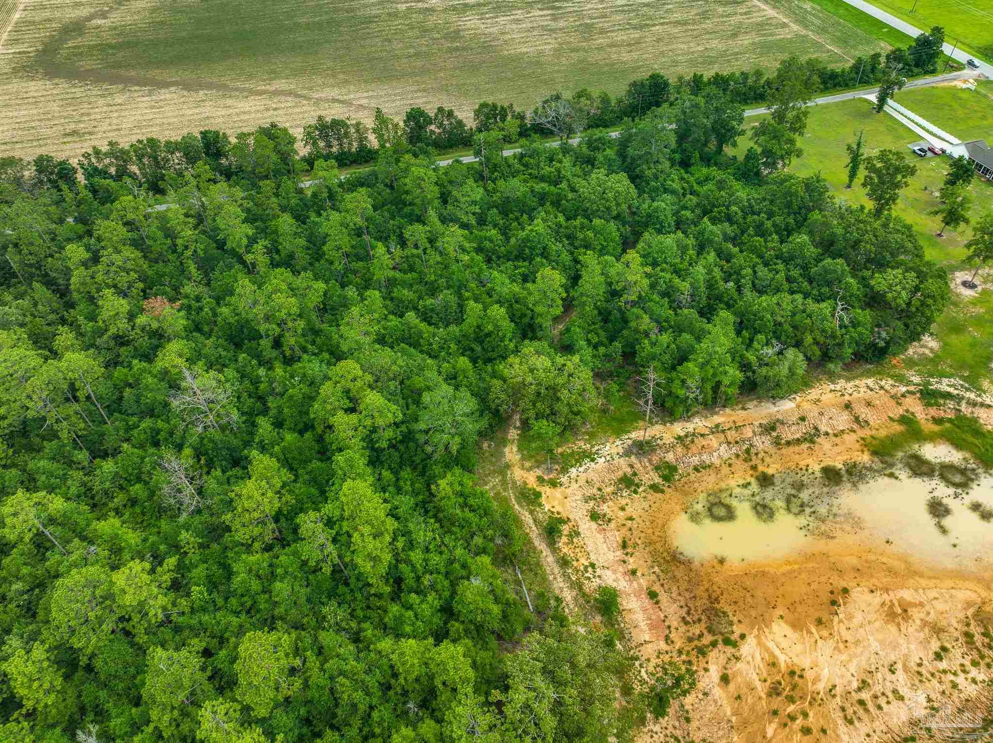 8165 Chumuckla Highway Pace, FL 32571 - Photo 48 of 50 a view of a large body of water with a building in the background