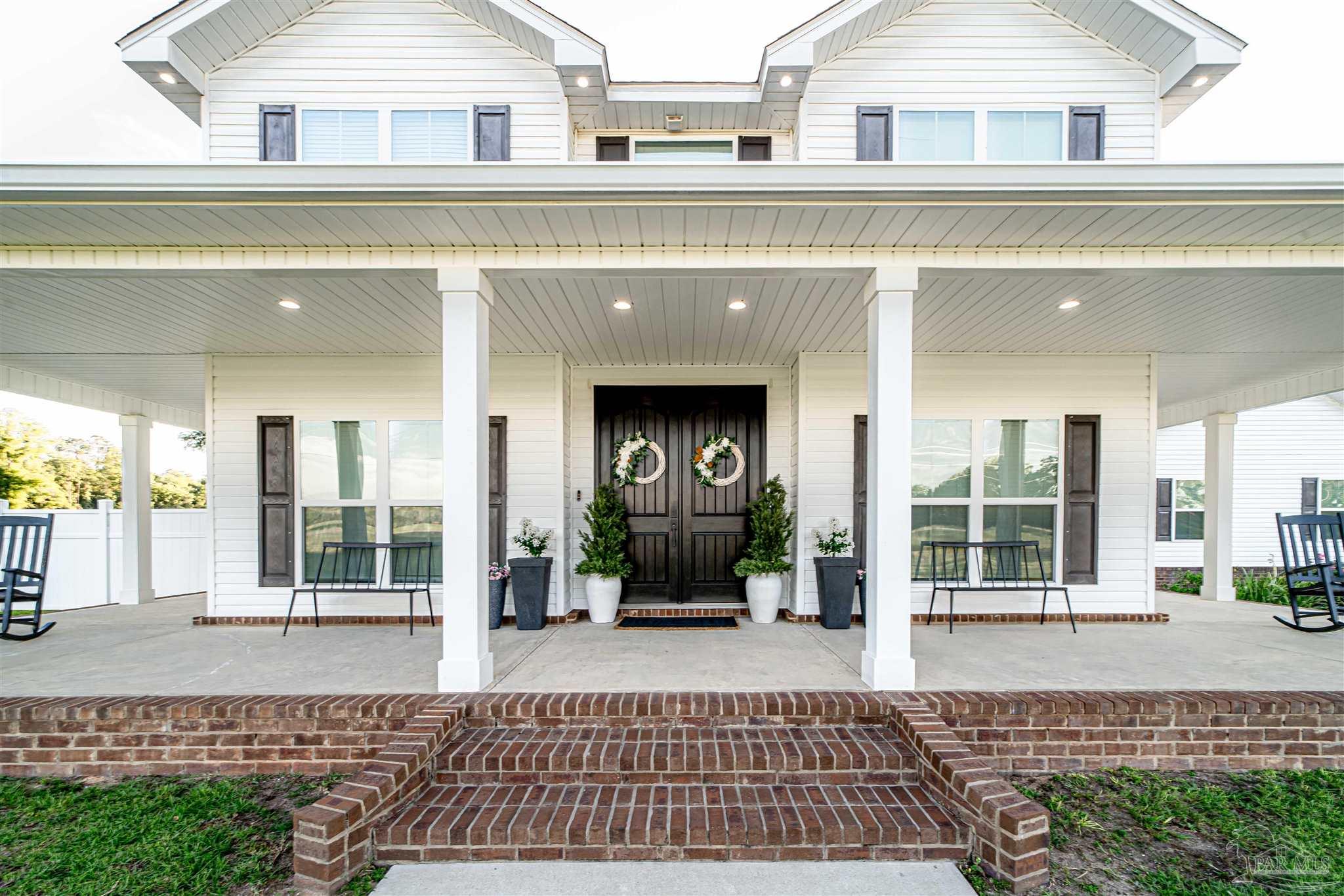 8165 Chumuckla Highway Pace, FL 32571 - Photo 6 of 50 a view of a building with a window