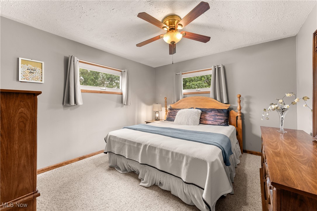 14808 Wheeler Road Lagrange, OH 44050 - Photo 24 of 50 Bedroom with a ceiling fan and a textured ceiling