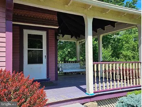 a view of a two chairs in the balcony
