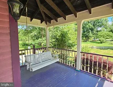 a view of a room with furniture and a window