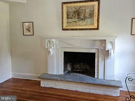 1195 Westbourne Road West Chester, PA 19382 - Photo 5 of 13 a view of a livingroom with a fireplace and wooden floor