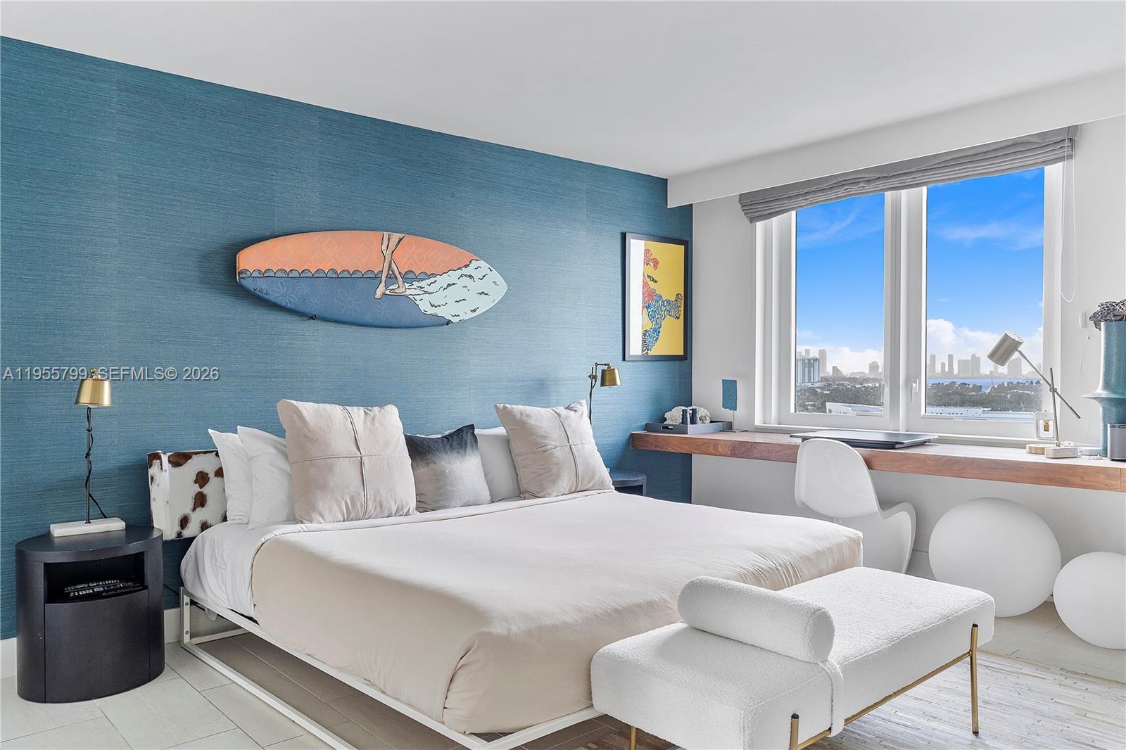 102 24th Street, Unit 1427 Miami Beach, FL 33139 - Photo 21 of 77 a bedroom with furniture and a large window