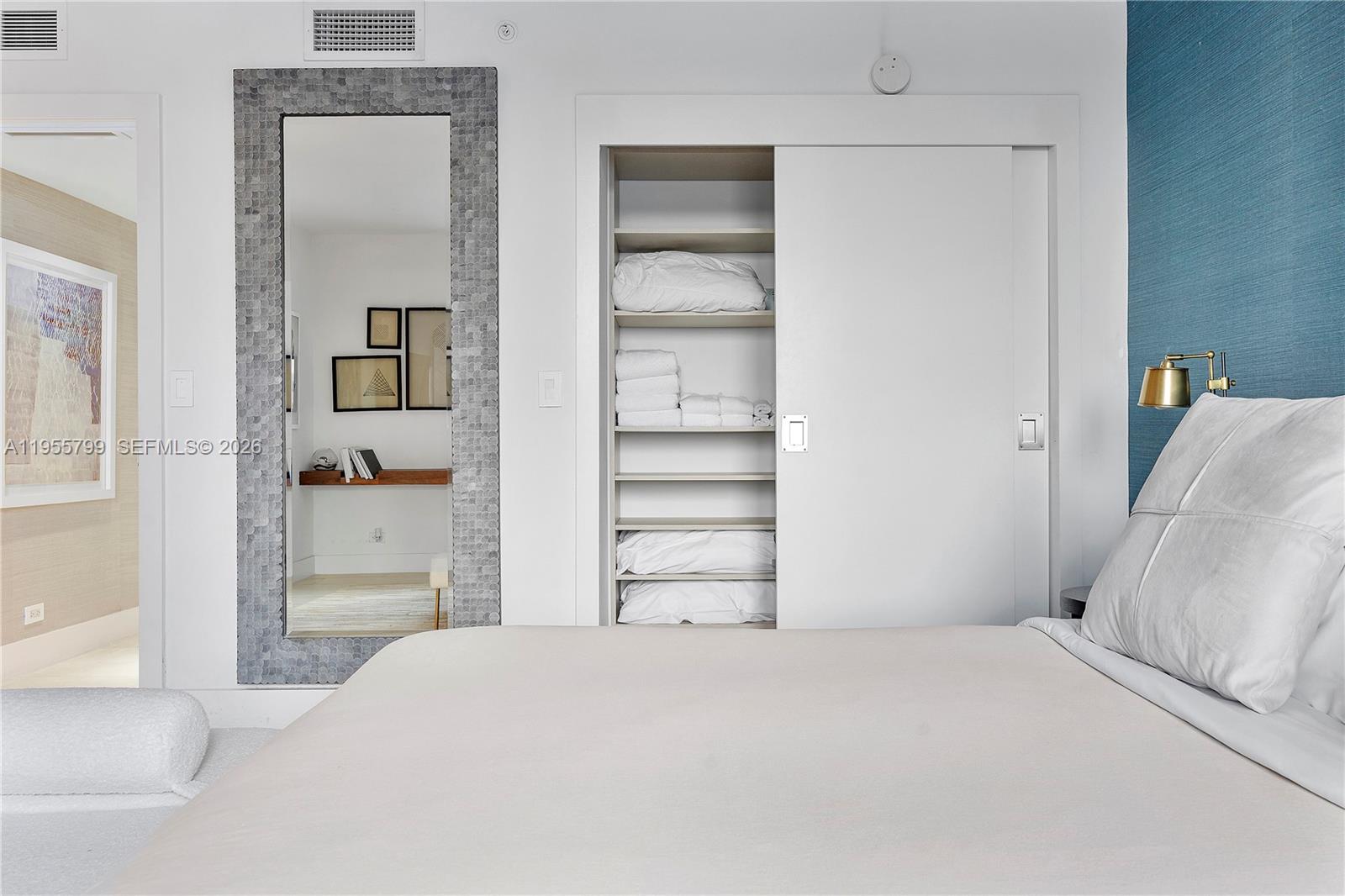 102 24th Street, Unit 1427 Miami Beach, FL 33139 - Photo 26 of 77 a bedroom with a bed and a cabinets