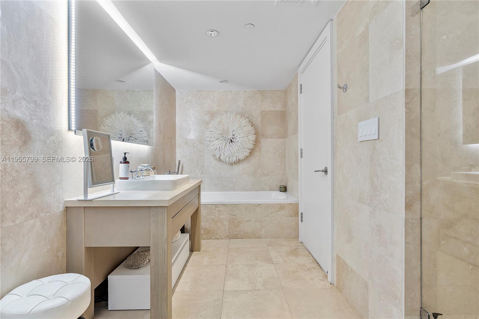 102 24th Street, Unit 1427 Miami Beach, FL 33139 - Photo 31 of 77 a bathroom with a sink a toilet and a bathtub