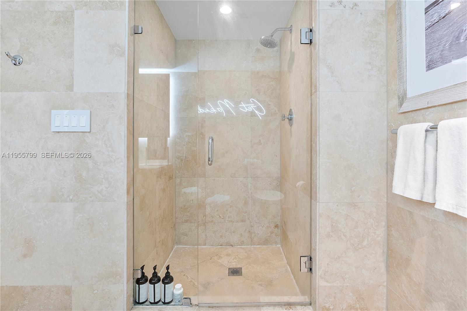 102 24th Street, Unit 1427 Miami Beach, FL 33139 - Photo 35 of 77 a bathroom with a glass shower door