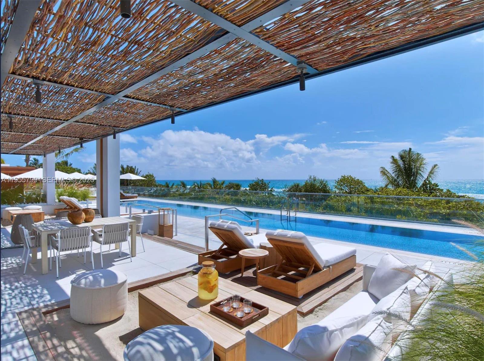 102 24th Street, Unit 1427 Miami Beach, FL 33139 - Photo 52 of 77 a view of swimming pool with lounge chairs