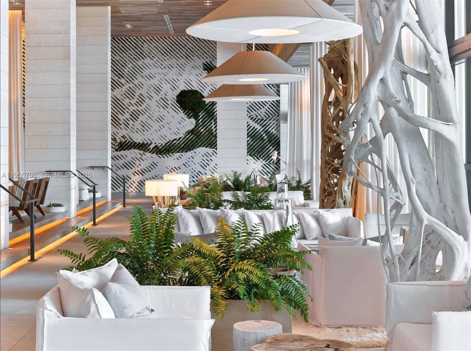 102 24th Street, Unit 1427 Miami Beach, FL 33139 - Photo 54 of 77 a front view of a house with outdoor seating