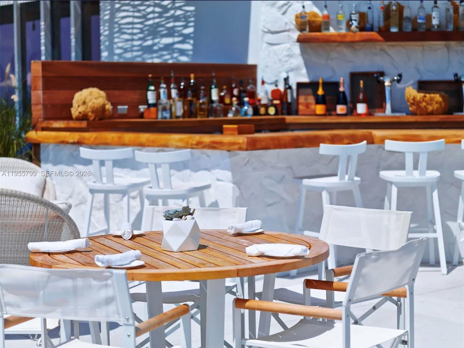 102 24th Street, Unit 1427 Miami Beach, FL 33139 - Photo 63 of 77 a dining table with chairs and table