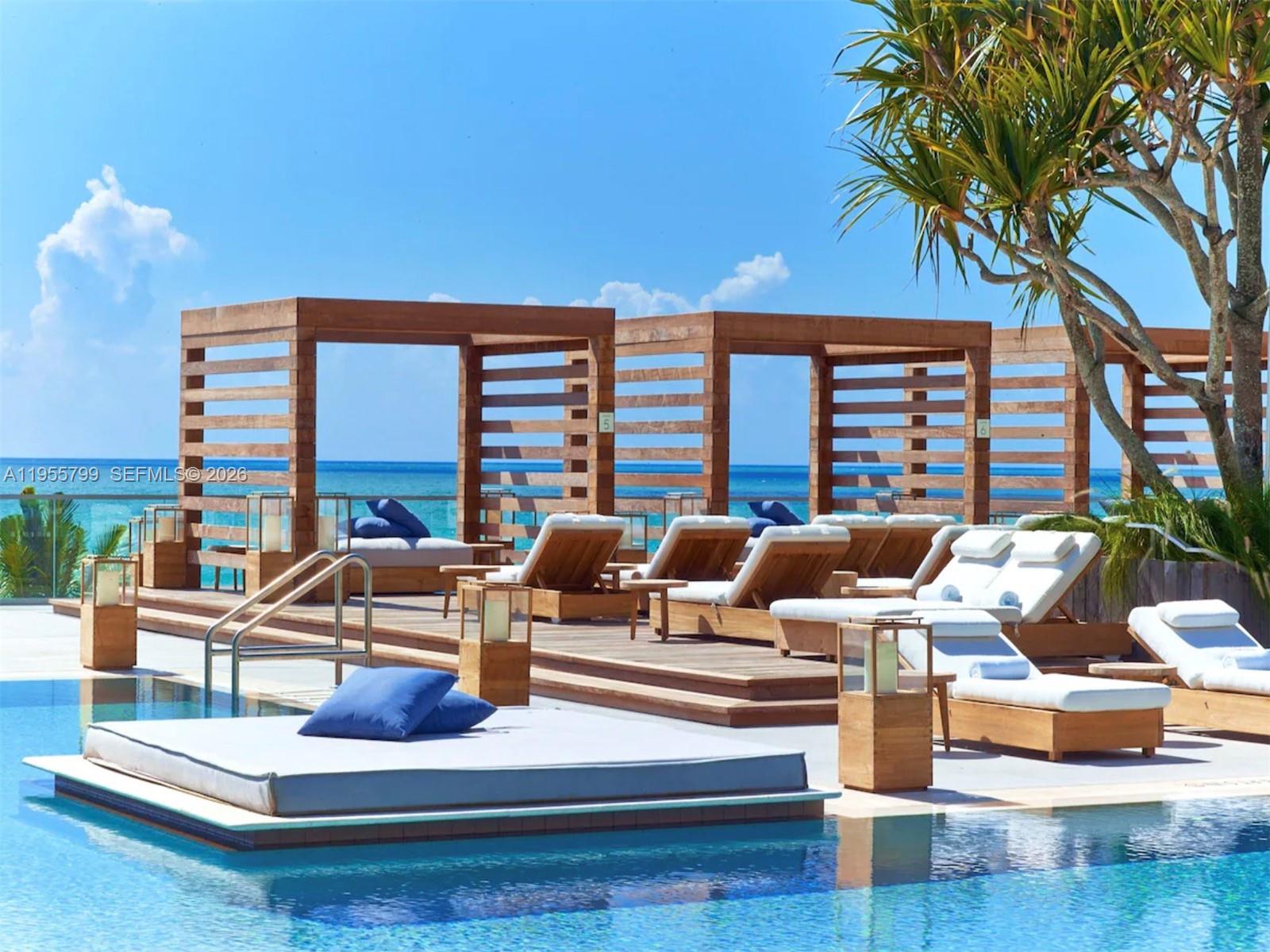 102 24th Street, Unit 1427 Miami Beach, FL 33139 - Photo 71 of 77 a living room with furniture and a large window