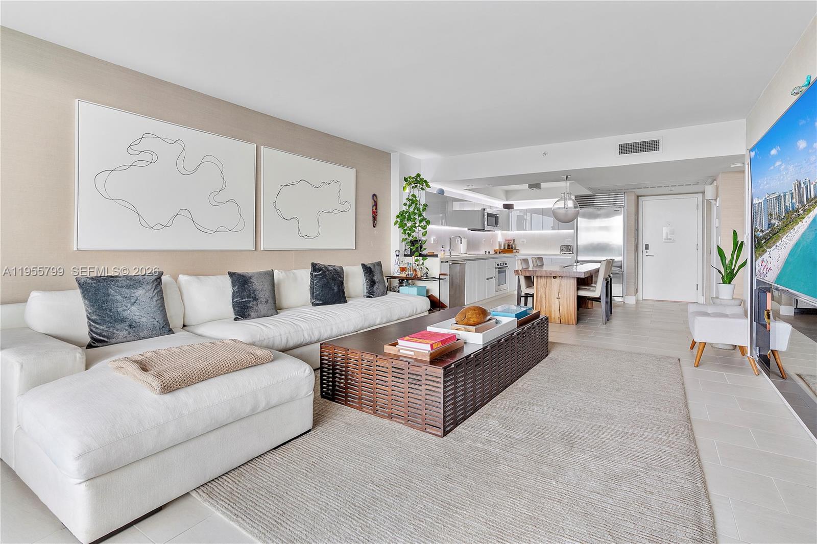 102 24th Street, Unit 1427 Miami Beach, FL 33139 - Photo 8 of 77 a living room with furniture and white walls
