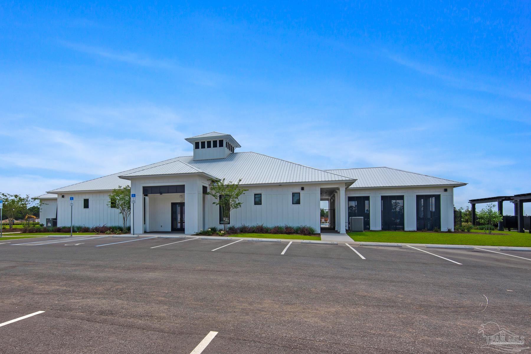 4773 Redhead Court Pace, FL 32571 - Photo 26 of 37 a front view of a house with a garden