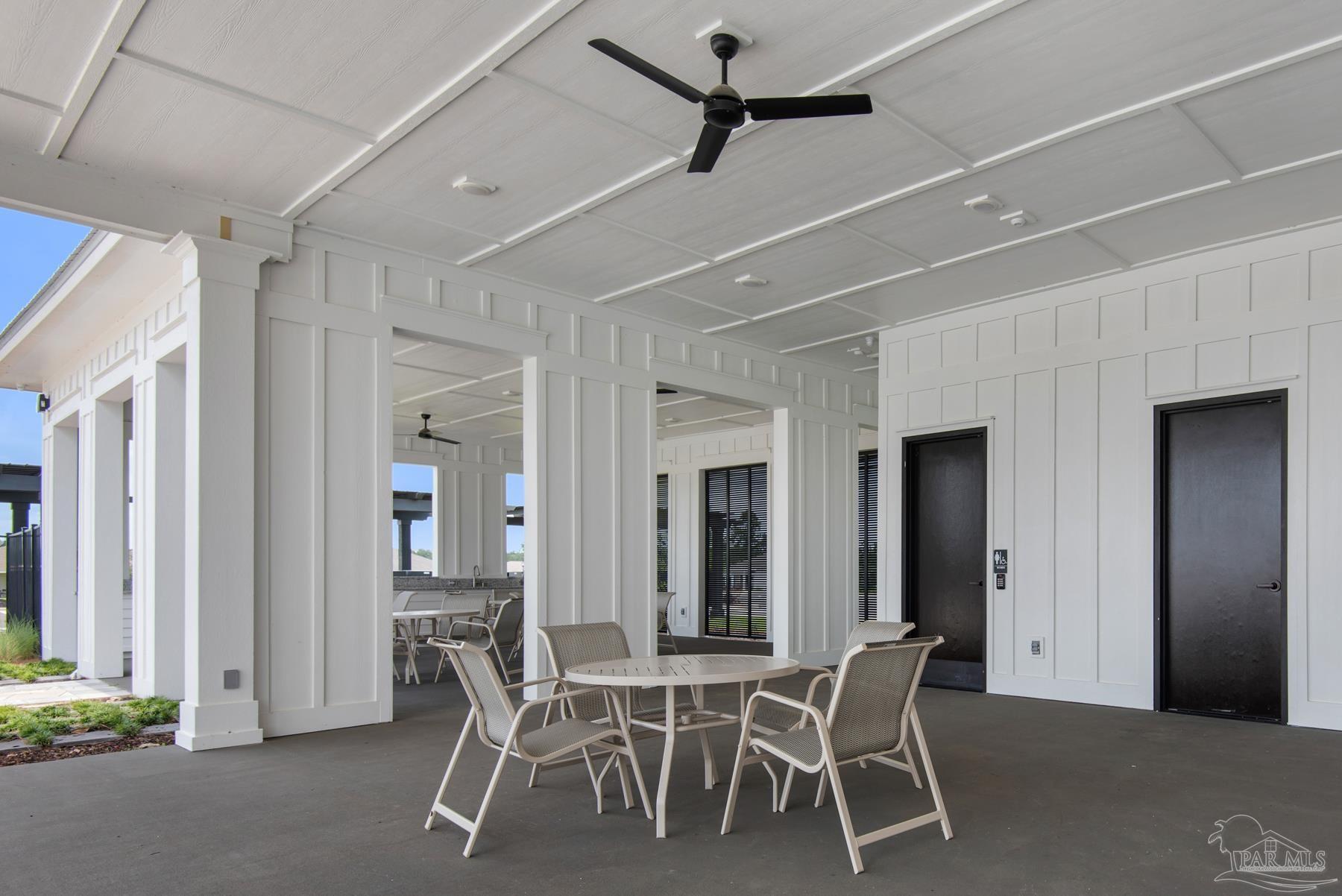 4773 Redhead Court Pace, FL 32571 - Photo 33 of 37 a dining room with furniture and a chandelier fan