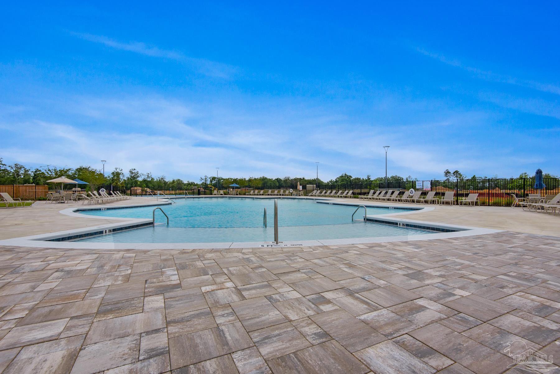 4773 Redhead Court Pace, FL 32571 - Photo 36 of 37 a view of a lake with houses in back