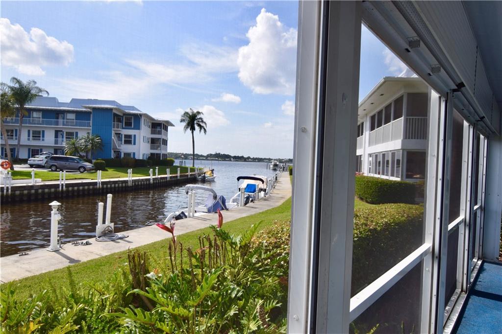 1858 Southwest Palm City Road, Unit 106 Stuart, FL 34994 - Photo 3 of 19 a view of swimming pool from a balcony