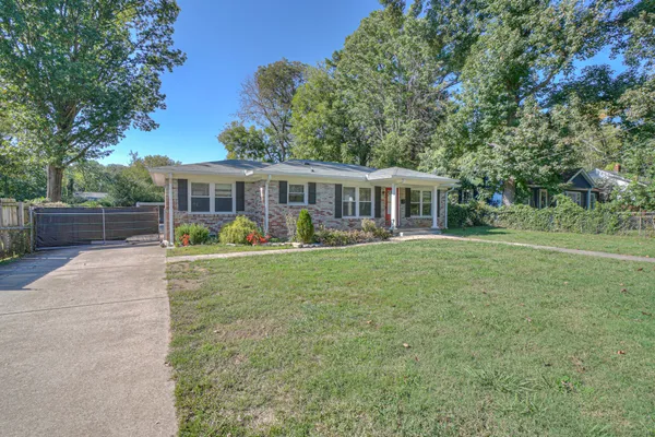 front view of a house with a yard
