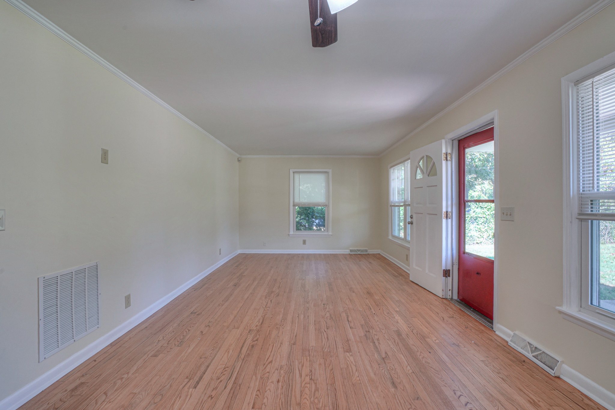 1827 Middle Tennessee Boulevard Murfreesboro, TN 37130 - Photo 10 of 21 an empty room with wooden floor and windows