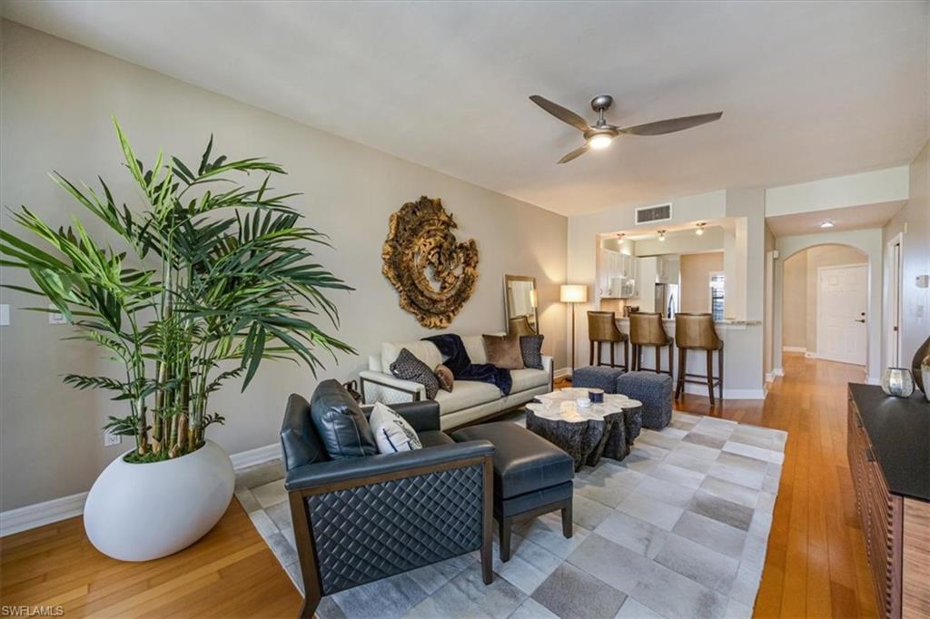 401 Bayfront Place, Unit 3404 Naples, FL 34102 - Photo 3 of 14 a living room with furniture and a clock