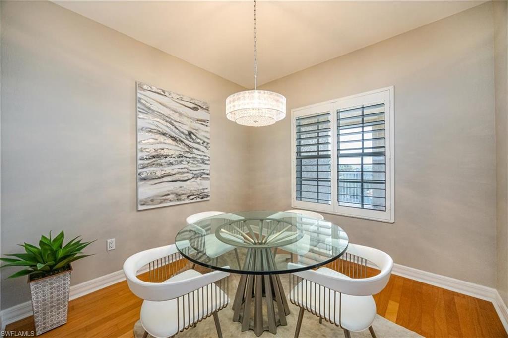 401 Bayfront Place, Unit 3404 Naples, FL 34102 - Photo 4 of 14 a view of a dining room with furniture and chandelier
