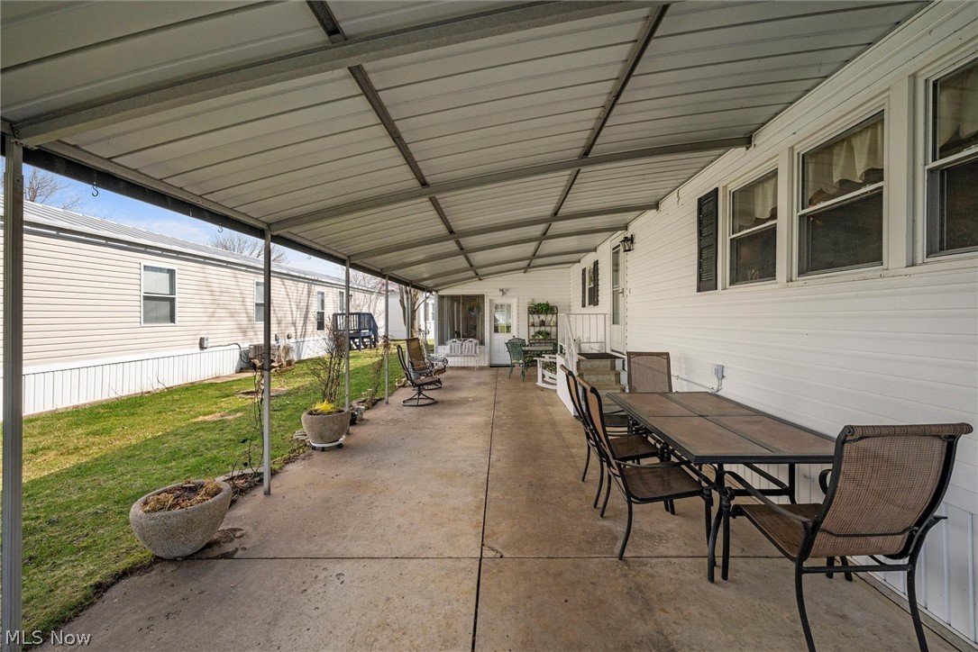 1623 Northeast Catawba Road, Unit 160 Port Clinton, OH 43452 - Photo 23 of 28 View of patio with outdoor dining area