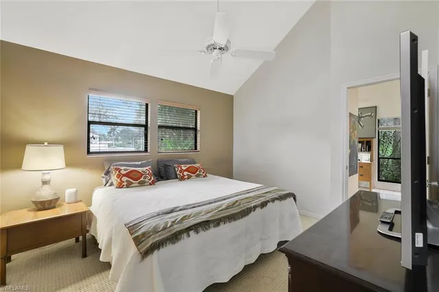 a bedroom with a bed and a table in it