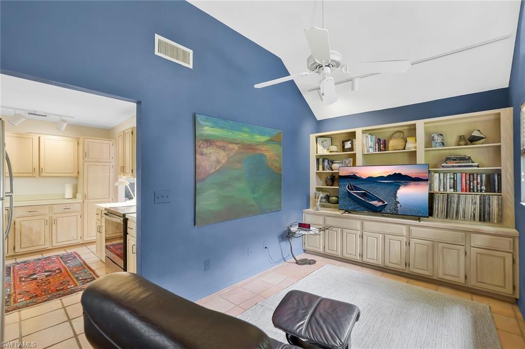 1329 Solana Road, Unit K5 Naples, FL 34103 - Photo 8 of 20 a living room with furniture and a flat screen tv
