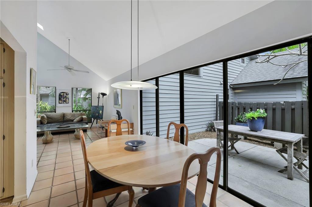 1329 Solana Road, Unit K5 Naples, FL 34103 - Photo 10 of 20 a view of a dining room with furniture window and outside view