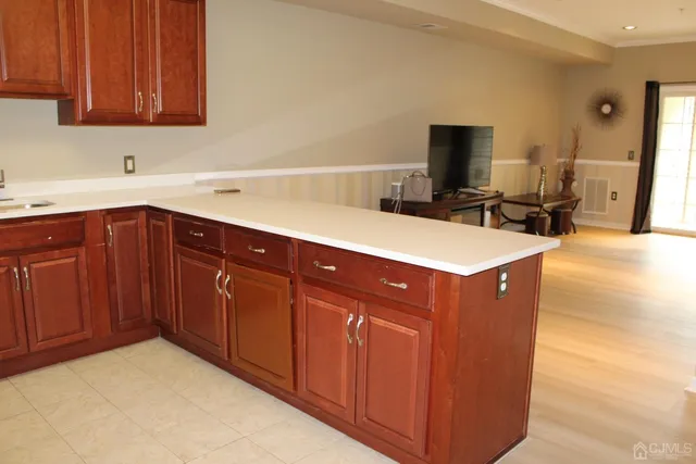 a kitchen with stainless steel appliances a sink and a microwave