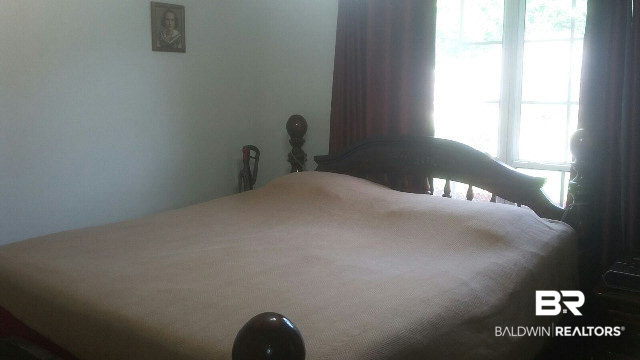8451 Kendall Court Mobile, AL 36695 - Photo 22 of 33 This is a large secondary bedroom. Additional square footage was added during construction.