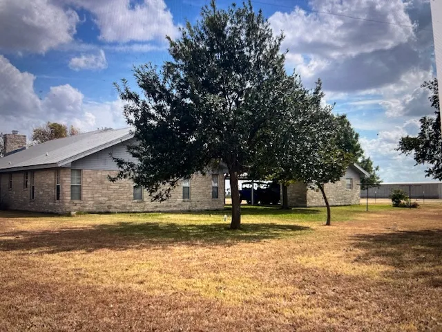 a bathroom with a granite countertop toilet and a shower