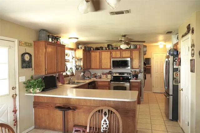 a view of house with backyard outdoor seating and hardwood