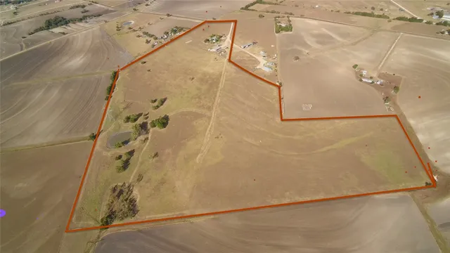a front view of a house with a garden and porch