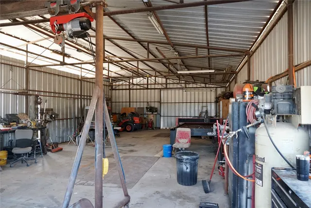 a kitchen with stainless steel appliances a stove a microwave and a refrigerator