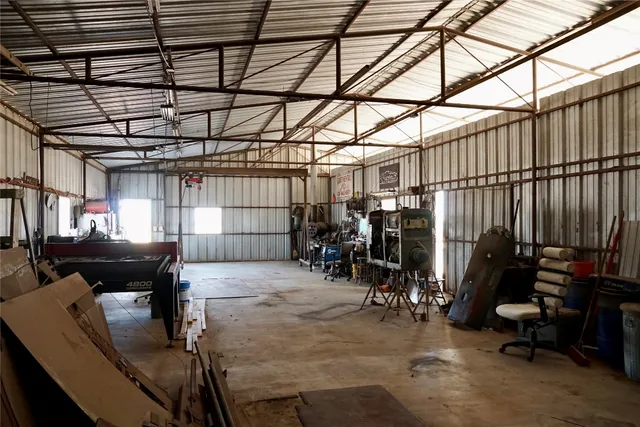 a view of a bathroom with a shower curtain and a dining table