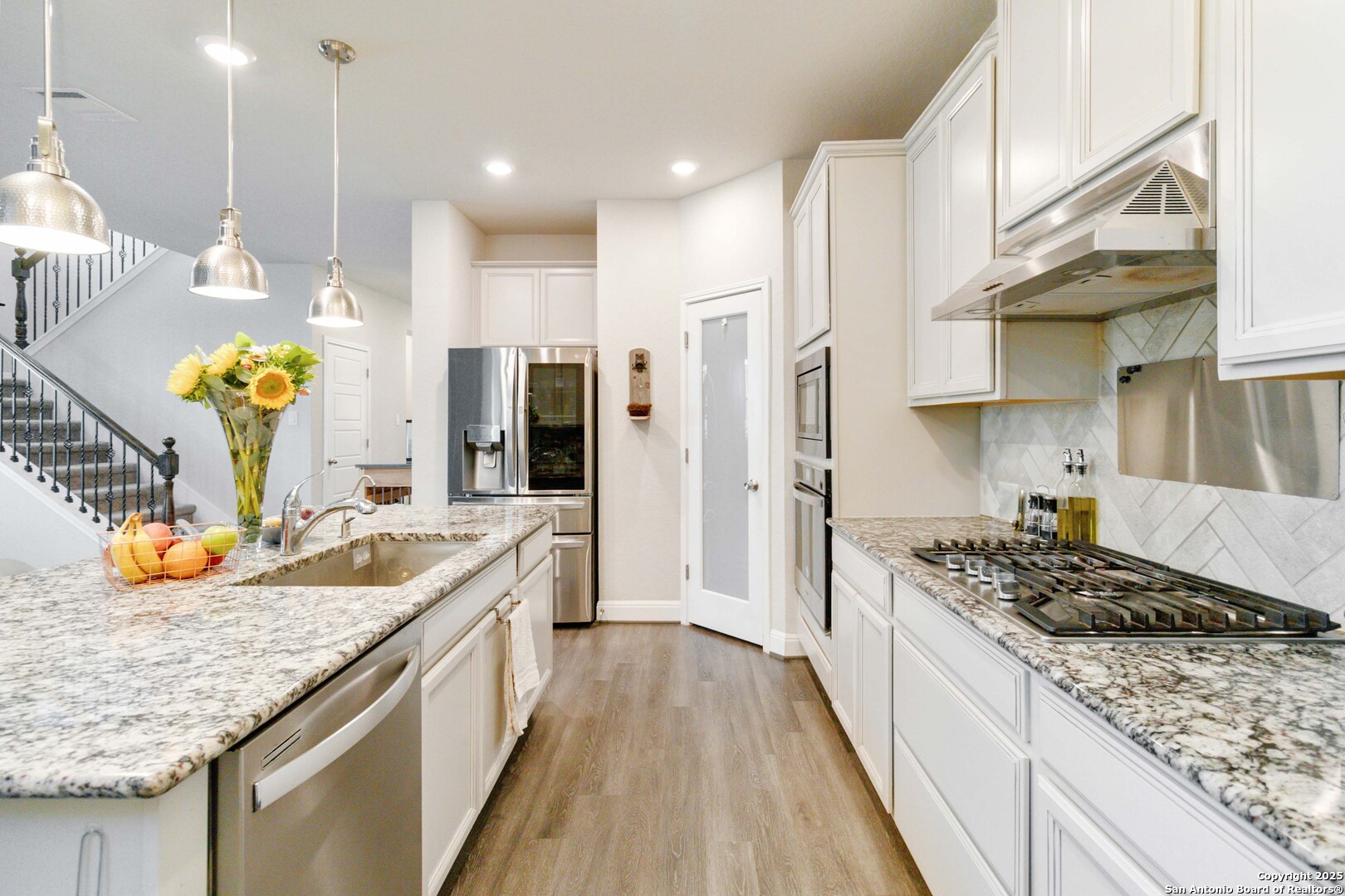 2210 Castello Way San Antonio, TX 78259 - Photo 15 of 48 a kitchen with a sink stove and refrigerator