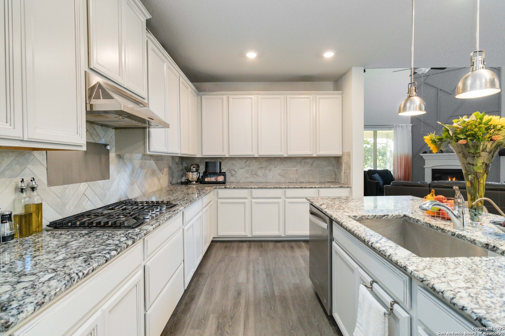 2210 Castello Way San Antonio, TX 78259 - Photo 16 of 48 a kitchen with a sink stove and cabinets