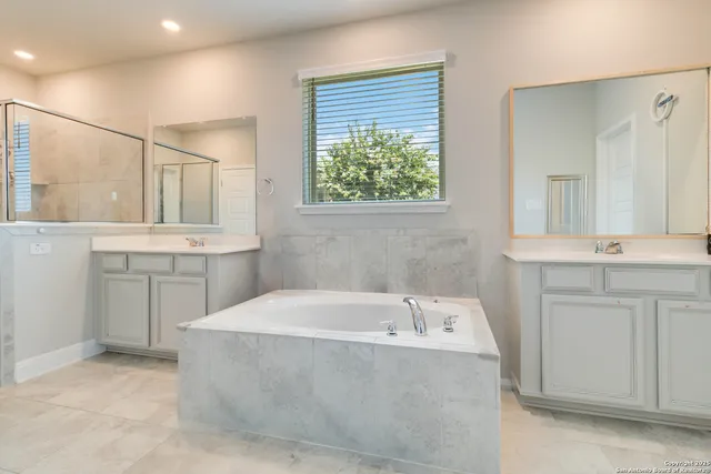 a bathroom with a bathtub and a sink