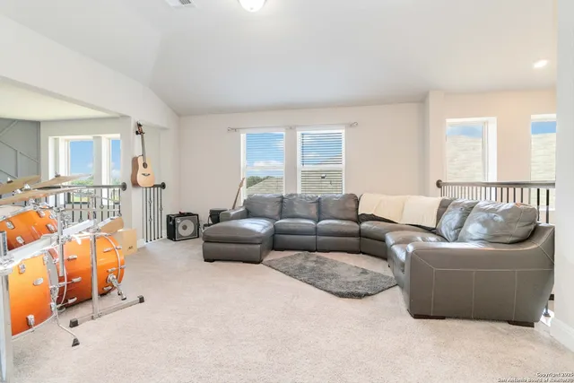 a living room with furniture and a couch