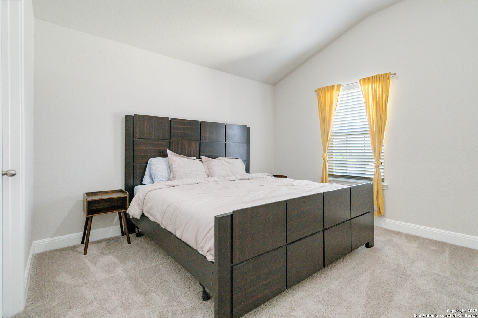 2210 Castello Way San Antonio, TX 78259 - Photo 28 of 48 a bed sitting in a bedroom next to a window